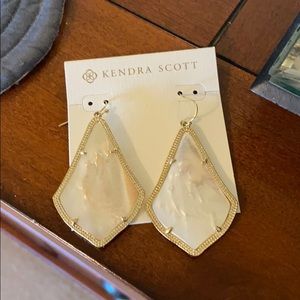 Kendra Scott mother of pearl earrings.